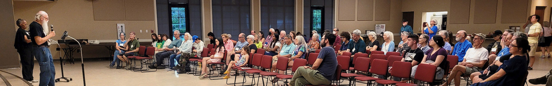 Large group of people watching talent show